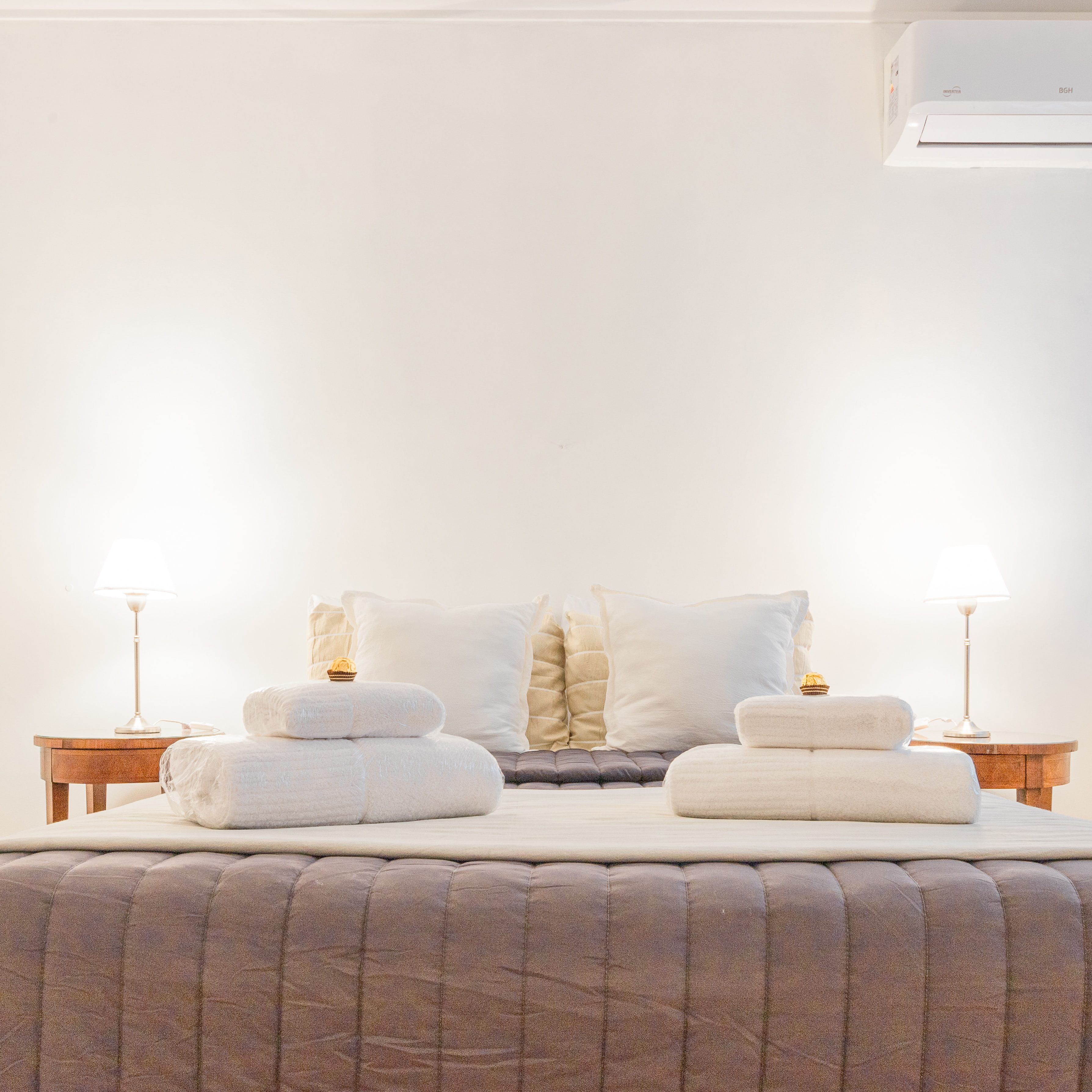 Header image serves as description of what we do Main header photo of a luxurious hotel bed with nicely laid towels